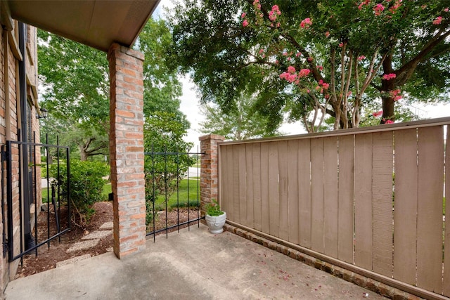 view of gate with fence