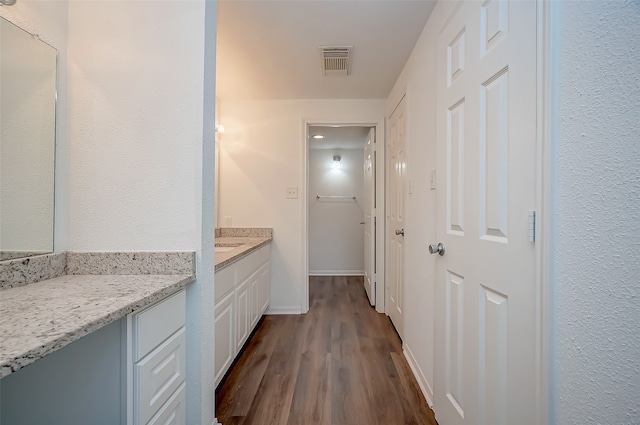 bathroom featuring vanity and hardwood / wood-style floors