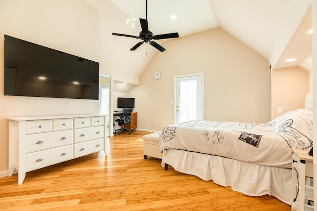 bedroom featuring ceiling fan, light wood-type flooring, and high vaulted ceiling