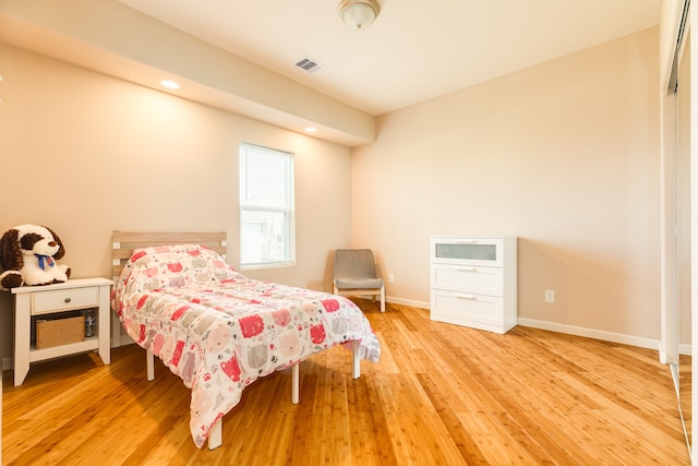 bedroom with light hardwood / wood-style flooring