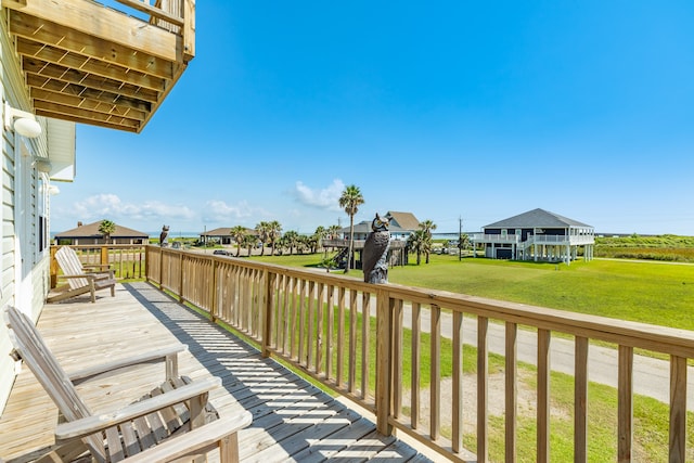 wooden deck with a yard