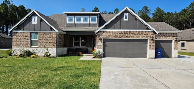 view of front of property with a garage and a front lawn