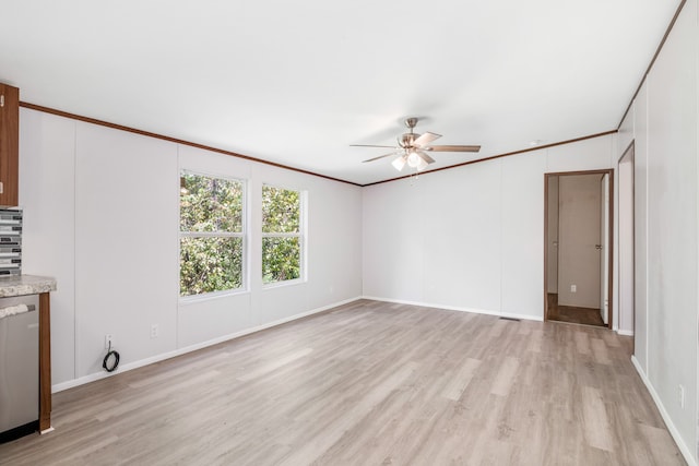 interior space featuring ornamental molding, light wood-type flooring, and ceiling fan