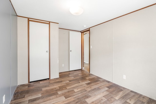 unfurnished bedroom with wood-type flooring