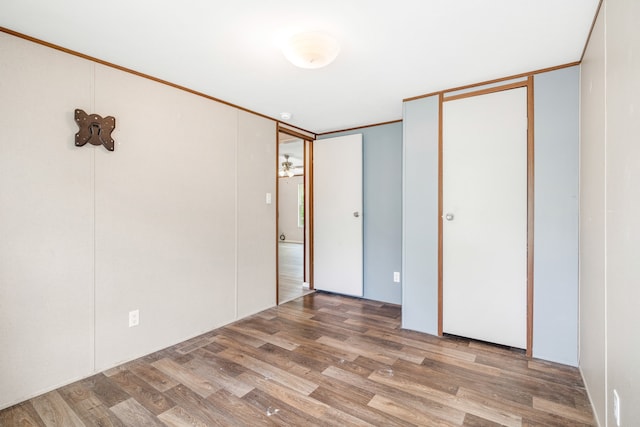 unfurnished bedroom with wood-type flooring