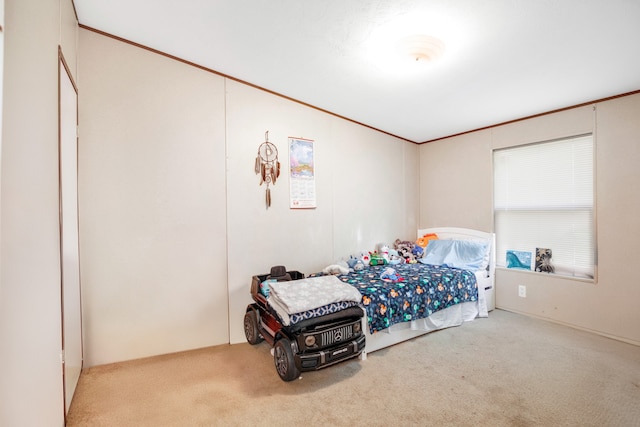 carpeted bedroom featuring crown molding