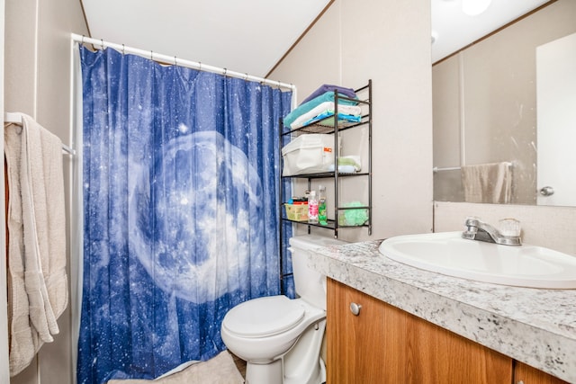 bathroom with walk in shower, vanity, and toilet