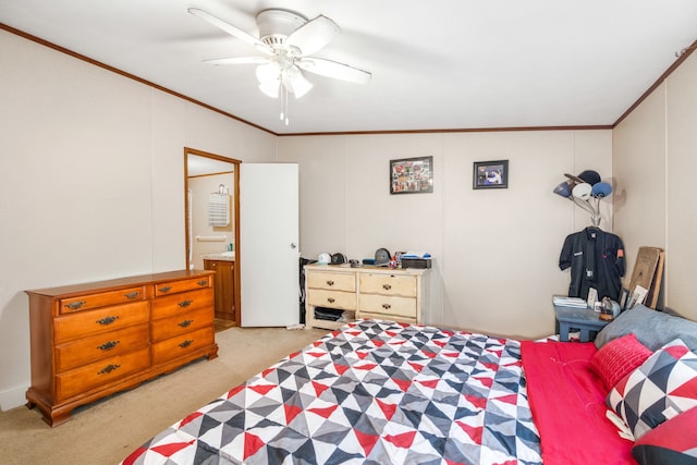 carpeted bedroom with vaulted ceiling, ceiling fan, ensuite bathroom, and crown molding