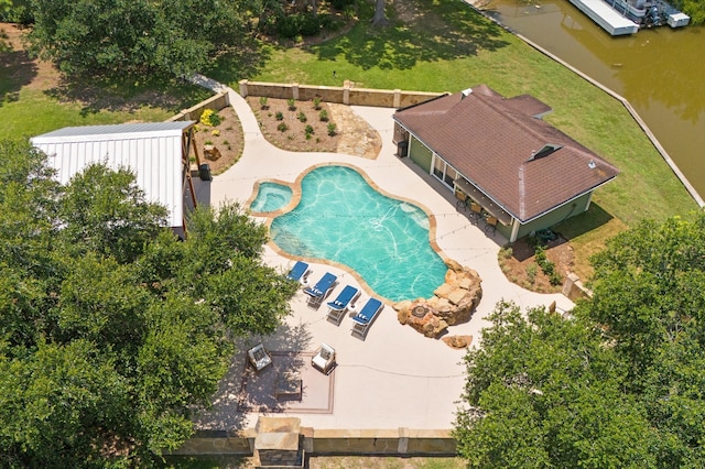 view of pool featuring a patio area and a yard