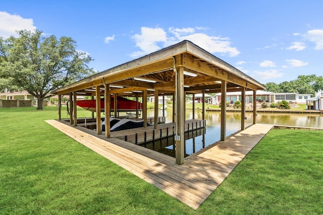 dock area featuring a yard and a water view