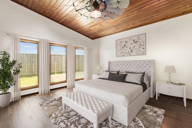 bedroom with wood ceiling, multiple windows, and dark hardwood / wood-style floors