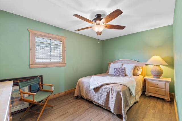 bedroom featuring light hardwood / wood-style floors and ceiling fan