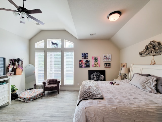 bedroom featuring lofted ceiling, ceiling fan, and light hardwood / wood-style flooring