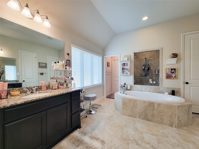 bathroom with shower with separate bathtub, lofted ceiling, and vanity