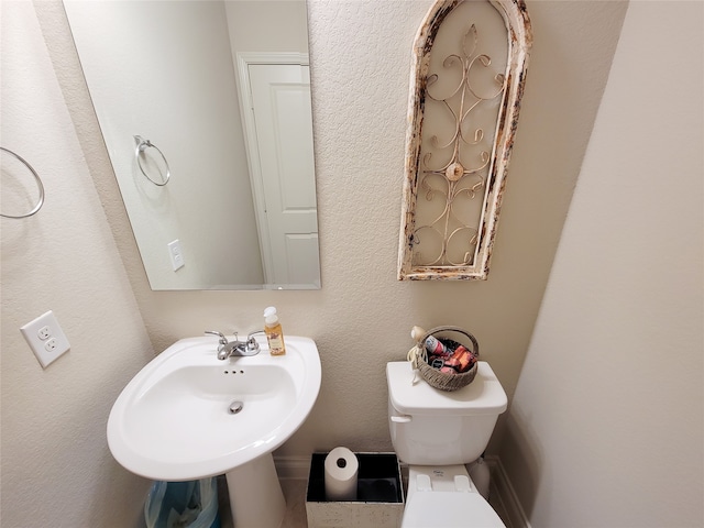 bathroom featuring sink and toilet