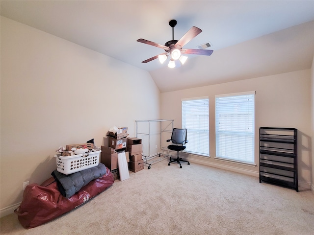 interior space featuring lofted ceiling, ceiling fan, and light colored carpet