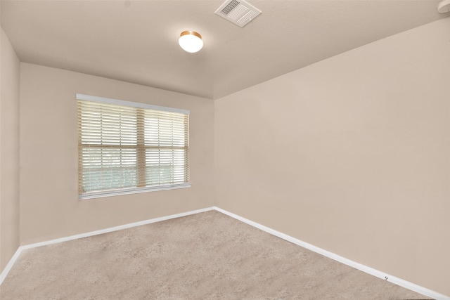 empty room featuring light colored carpet