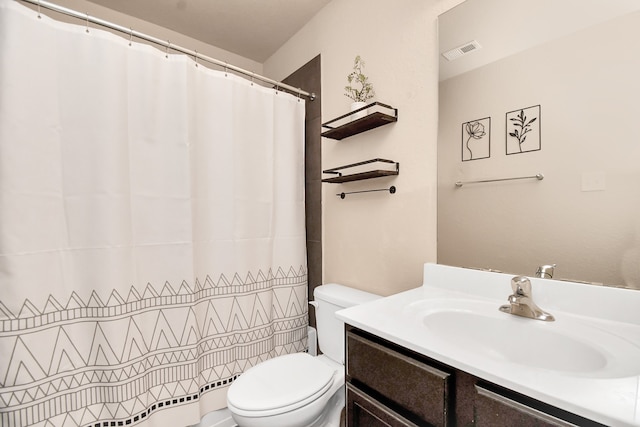 bathroom with a shower with curtain, vanity, and toilet