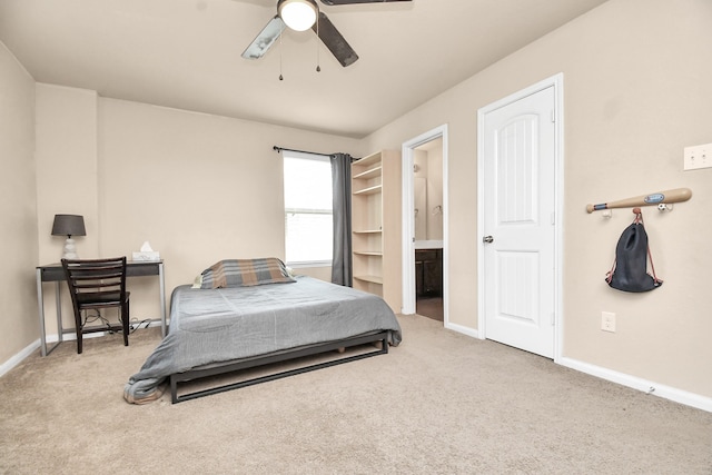 carpeted bedroom with ceiling fan and ensuite bathroom