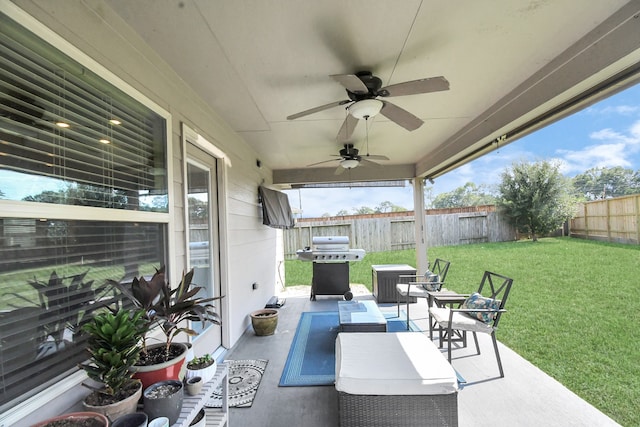 view of patio with ceiling fan and grilling area