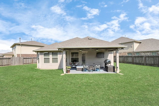 rear view of property with a lawn, an outdoor hangout area, ceiling fan, and a patio area