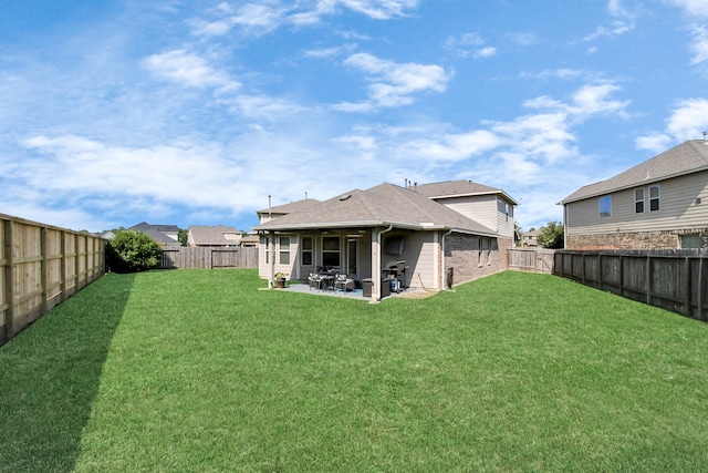 exterior space with a yard and a patio area