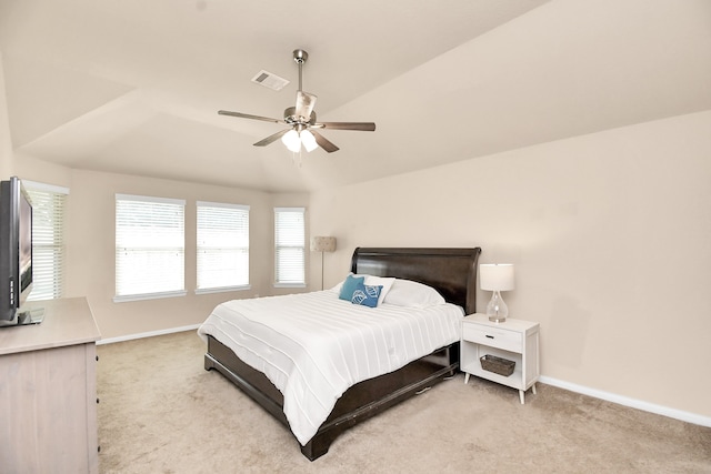 bedroom featuring ceiling fan, light carpet, and vaulted ceiling