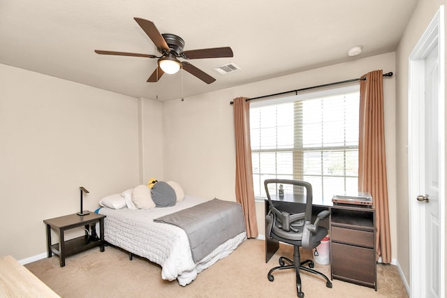 bedroom with ceiling fan and light colored carpet