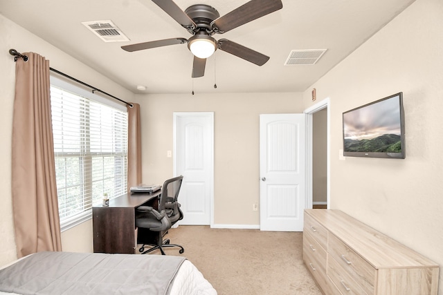 bedroom featuring light carpet and ceiling fan