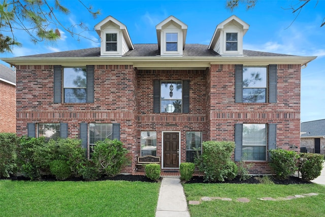 view of front of house with a front lawn