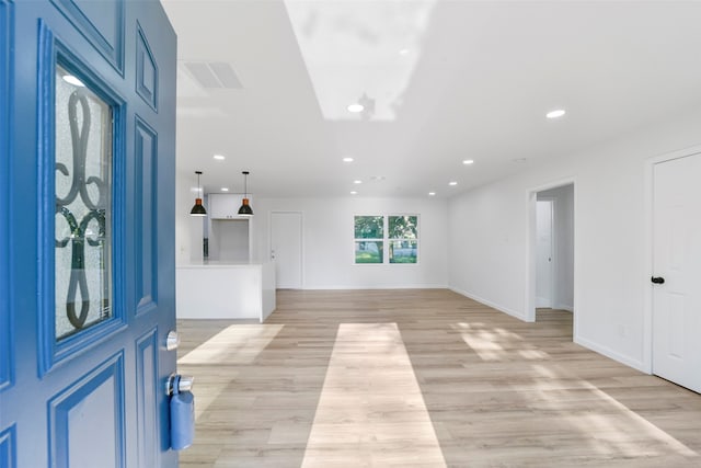 foyer entrance with light wood-type flooring