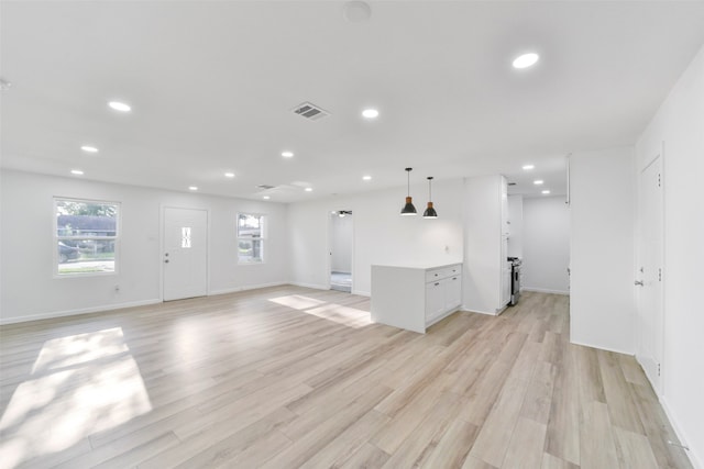 unfurnished living room featuring light hardwood / wood-style floors