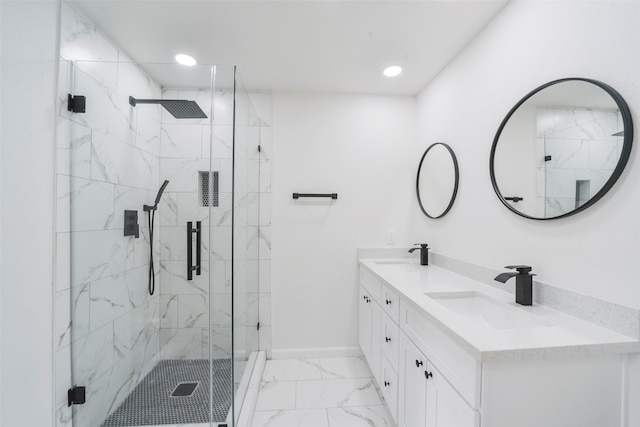 bathroom featuring walk in shower and vanity