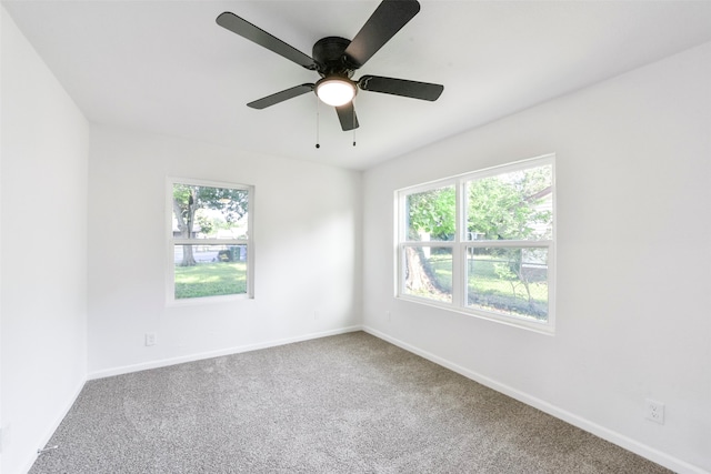 carpeted empty room with ceiling fan