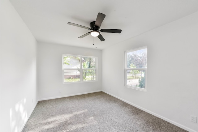 unfurnished room featuring ceiling fan and carpet