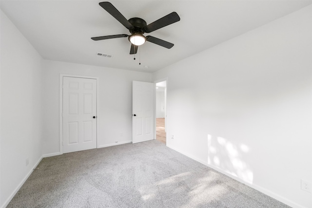 unfurnished bedroom with carpet floors and ceiling fan