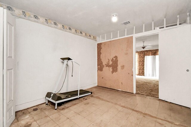 exercise area with ceiling fan