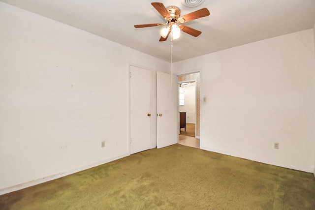 empty room featuring carpet and ceiling fan