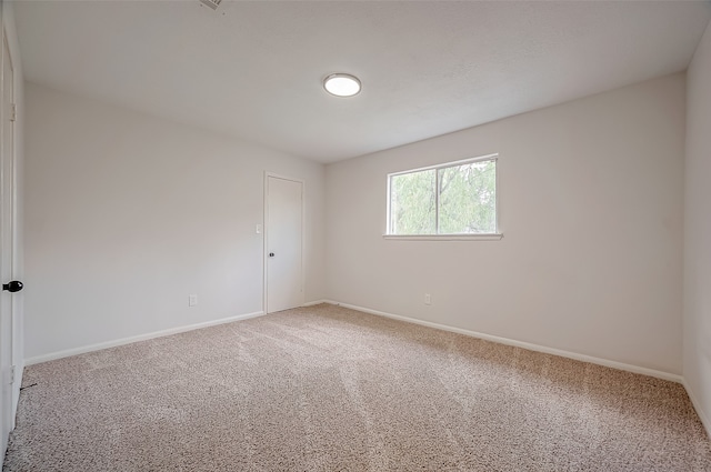 unfurnished room with carpet flooring