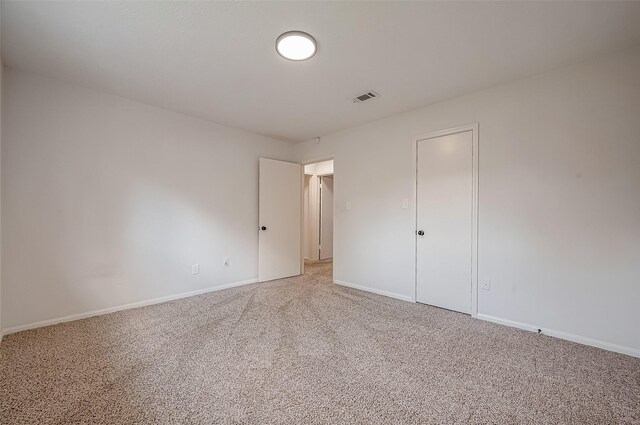 unfurnished bedroom with carpet