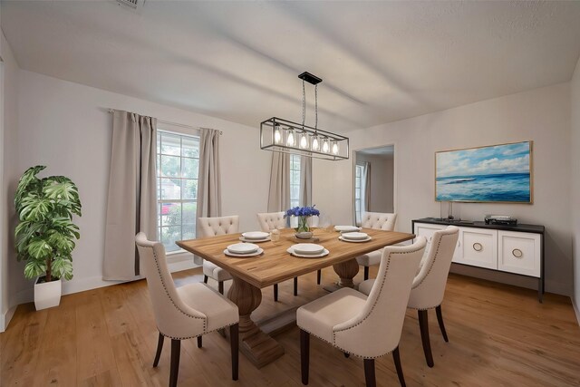 dining room with light hardwood / wood-style flooring