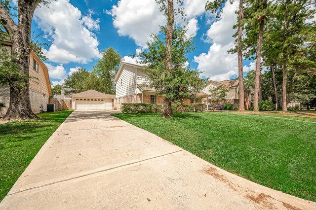 view of front of home featuring a garage and a front lawn