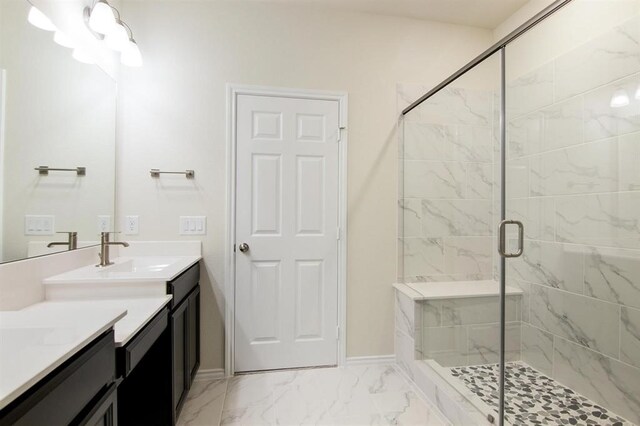 bathroom with walk in shower and vanity