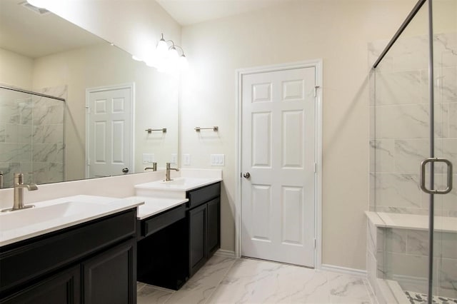 bathroom with vanity and a shower with shower door