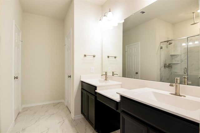 bathroom with vanity and a shower with shower door