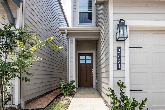 doorway to property featuring a garage