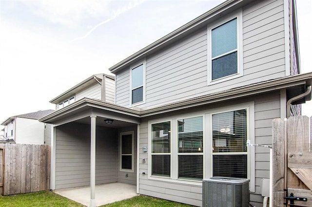 back of house with a patio and central air condition unit