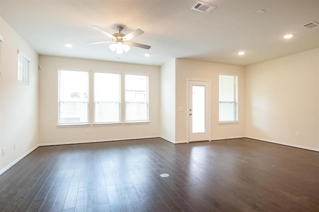 interior space with ceiling fan and dark hardwood / wood-style flooring