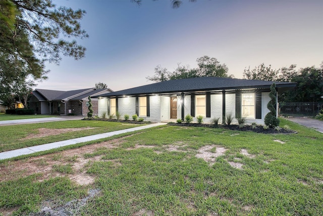 view of front of house with a lawn