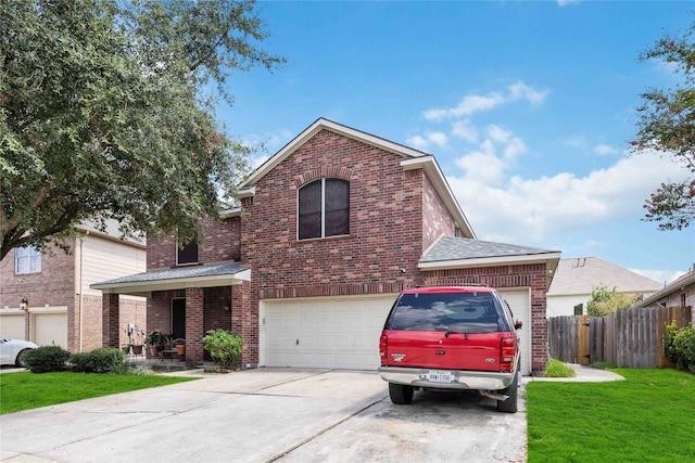 front of property featuring a garage and a front yard